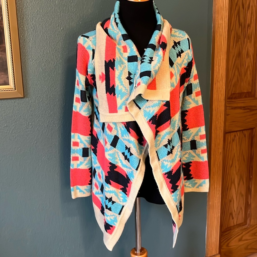 Western inspired cardigan in pinks, navy, blue and cream. Perfect w jeans & tee.
